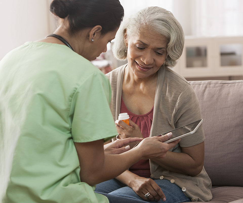 Senior Care Plus insured woman using medication