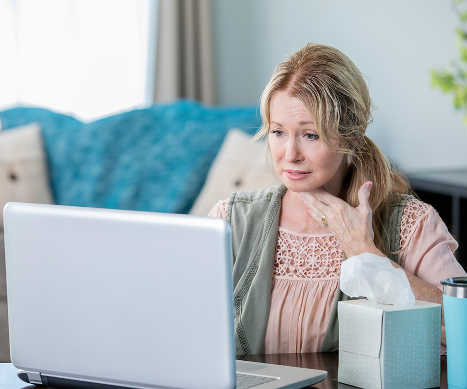Woman is describing her flu symptoms to doctor during Telehealth visit