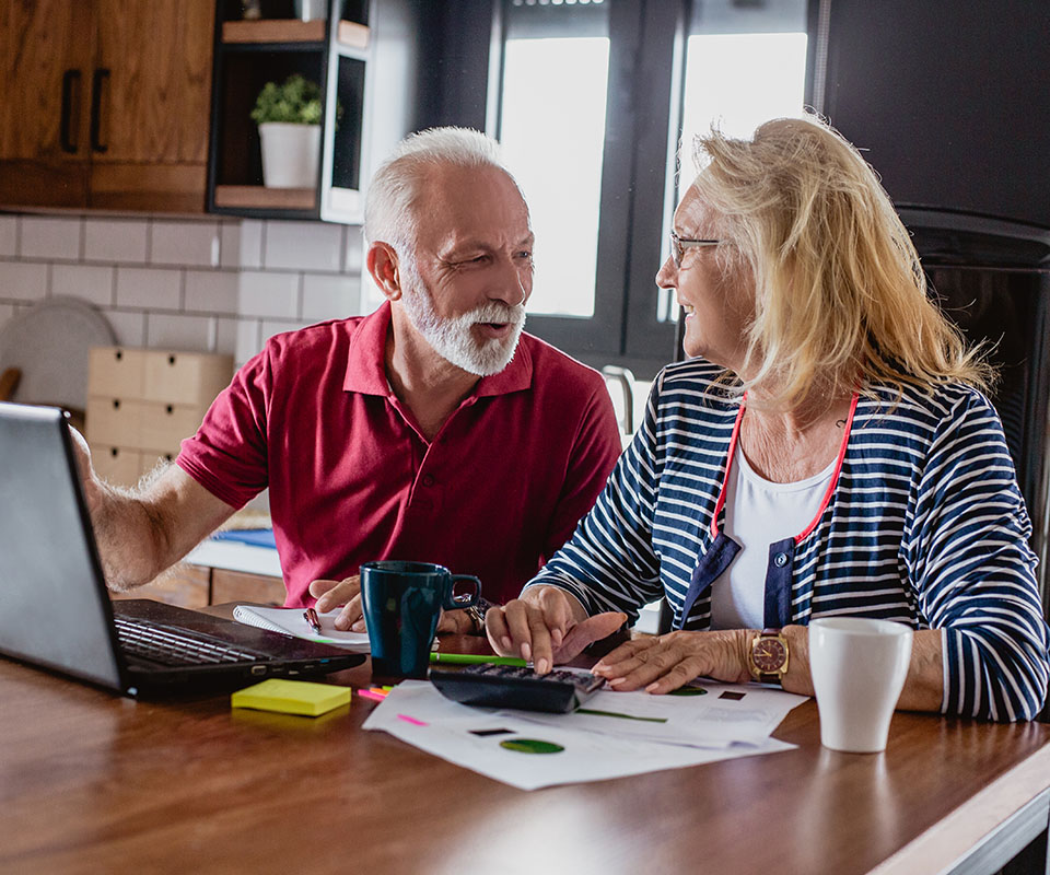 Senior couple is discussing a home budget together at home