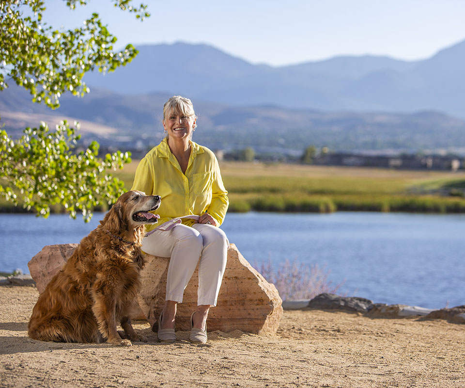 Senior woman with dog golf course_960x8002 senior woman with dog at a golf course