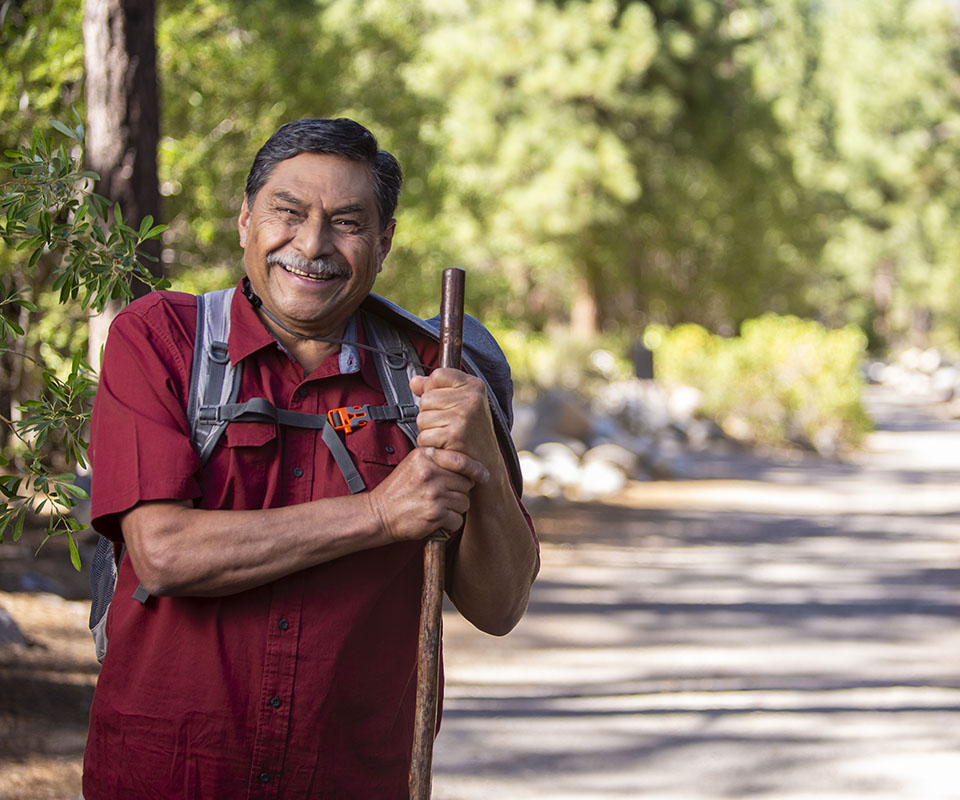 Senior Care Plus Insured man hiking