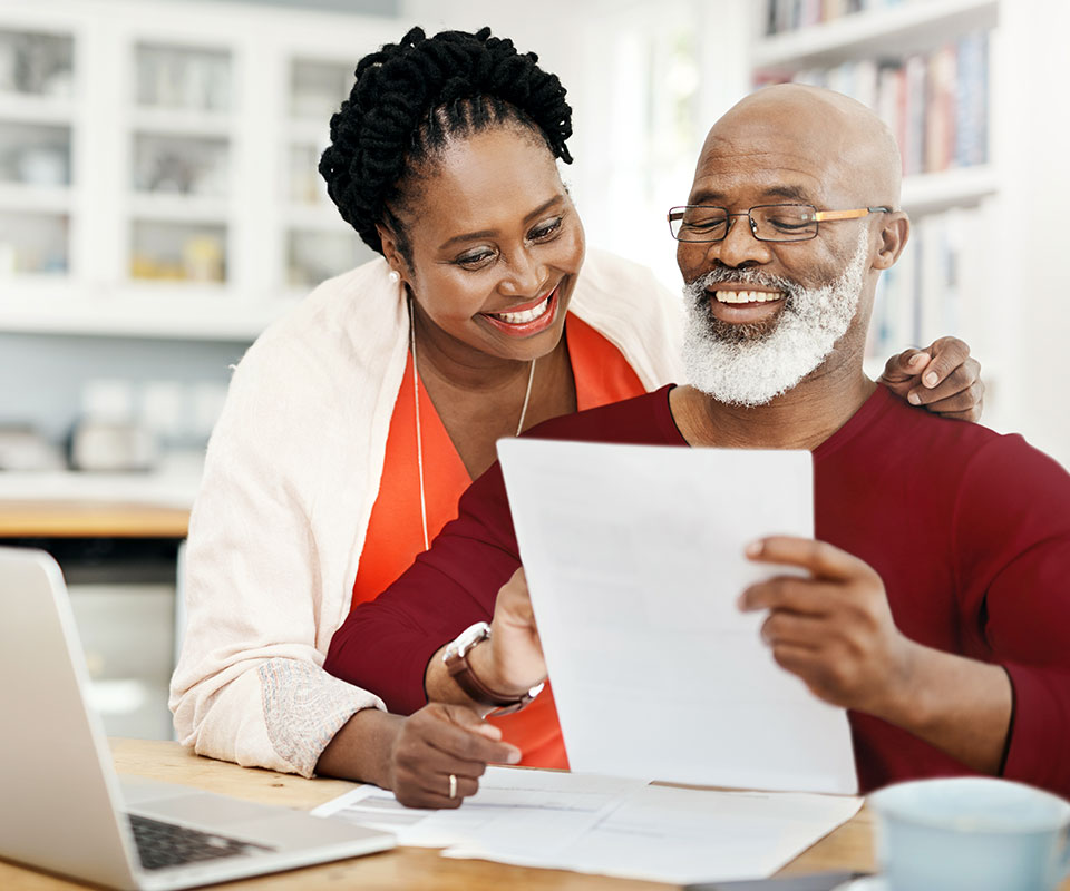 A couple looking over their Senior Care Plus benefits