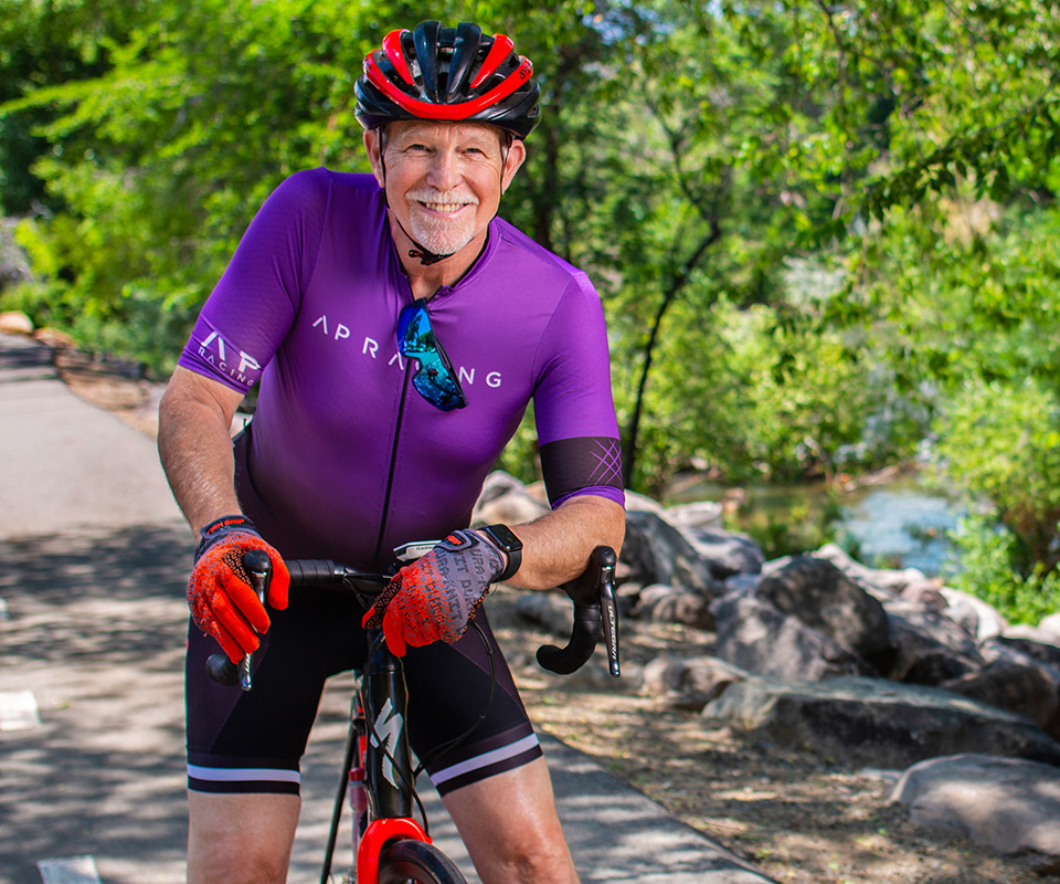 Senior care Plus Insured man riding a bike