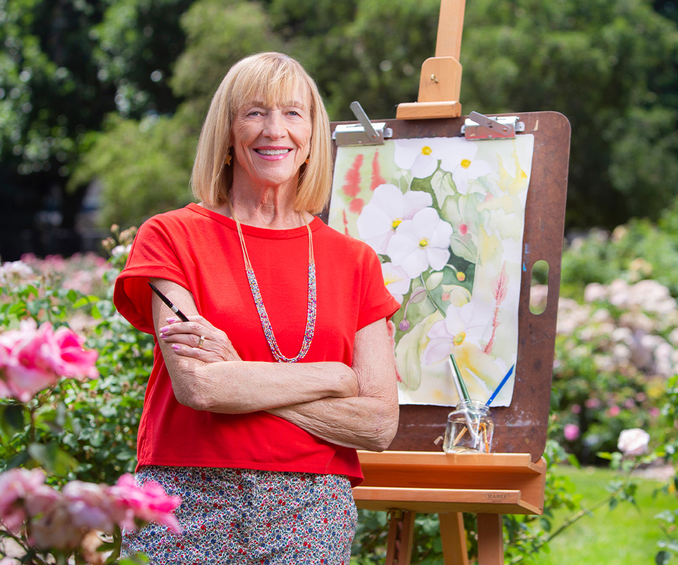 Senior care Plus Insured woman painting flowers